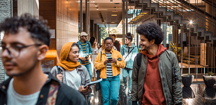 Students on campus leave their class.